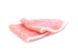 Raw pork meat with parsley herb leaves isolated on white background