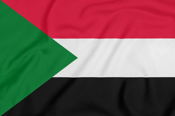 Obraz premium Flag of Sudan on textured fabric. Patriotic symbol