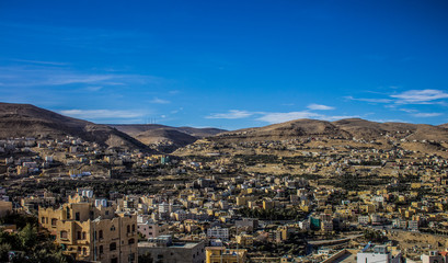Obraz premium poor Arabic city street ghetto district in Middle East dry desert highland hills 