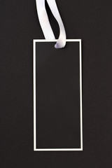 label (tag) on black background. - Image .