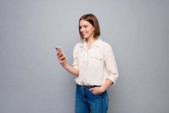 Close up photo amazing beautiful she her lady hold hands arms telephone wondered look screen reader email letters instagram followers wear casual jeans denim white shirt isolated grey background