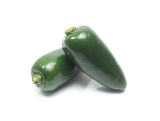 green chilies on white background (jalapeno)