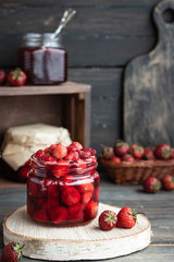 Strawberry jam in a glass jar