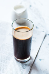 One strong espresso in a tall glass