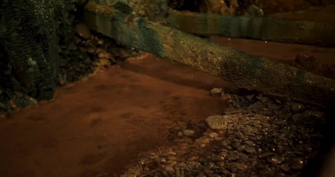 water dripping off old rusty mining equipment