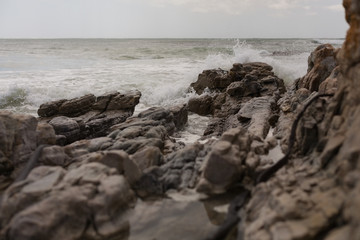 Sea waves splashing on the rock