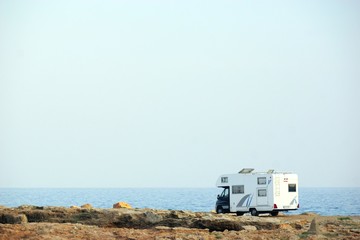 House on the wheels / Camper van on the seaside, travel in vacation