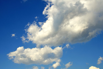 White clouds in the bright blue sky. The beauty of the nature.