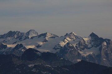 Fototapeta na wymiar High mountains seen from Mount Stanserhorn, Switzerland.