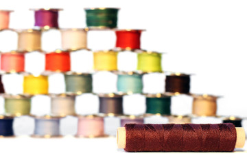 Spools of thread on a white background. For sewing