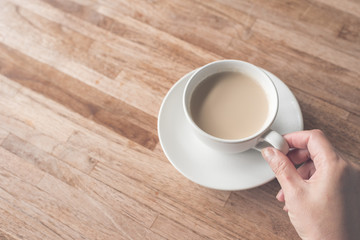 woman hold a cup a coffee