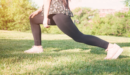 Obraz na płótnie Canvas Woman on a grass background. Outdoors, Healthy lifestyle. Fitness, Yoga