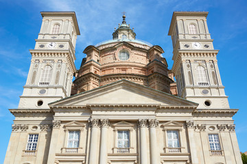 Fototapeta na wymiar Sanctuary of Vicoforte church facade, low angle view in a sunny summer day in Piedmont, Italy