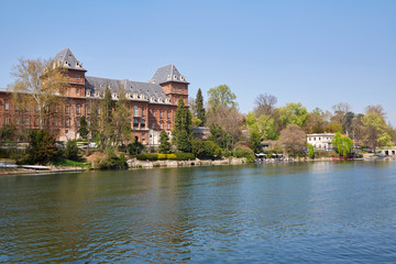 Fototapeta na wymiar Valentino castle and Po river bank, clear blue sky in Piedmont, Turin, Italy