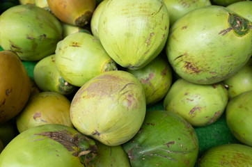 coconut fruit stacked on the marketplace