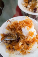 eating shaved ice with colorful dessert