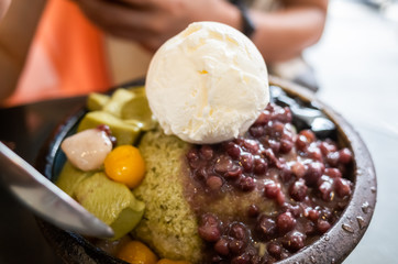 eating shaved ice with colorful dessert