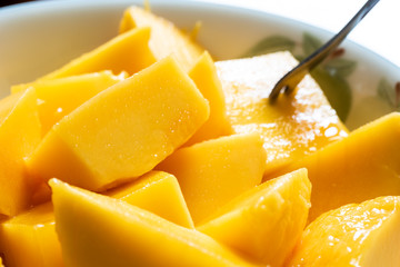 yellow mango on a dish