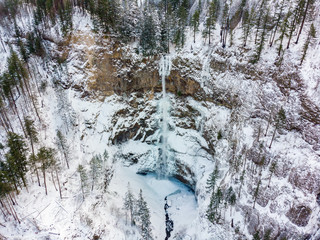 Multnomah Falls from above. View of a frozen waterfall after a massive snowfall in Columbia River Gorge