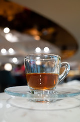 cup of coffee in glass on table