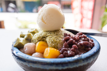 eating shaved ice with colorful dessert