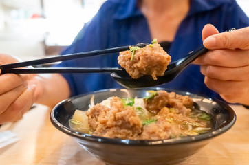 Taiwanese food of soup noodles with pork ribs cakes
