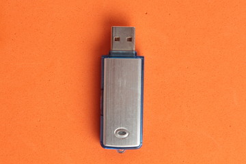 Side view of silver USB memory stick  on white
