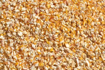 Background texture of crushed seed and grain mix for livestock and bird feed