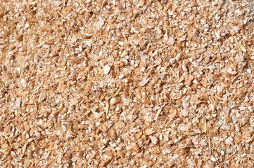 Background texture of crushed seed and grain mix for livestock and bird feed