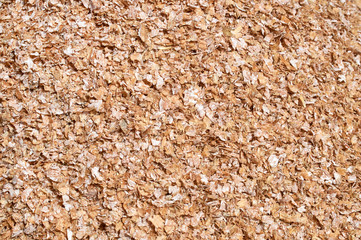 Background texture of crushed seed and grain mix for livestock and bird feed