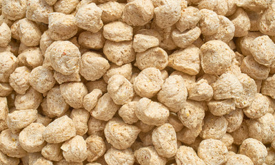 Background texture of crushed seed and grain mix for livestock and bird feed
