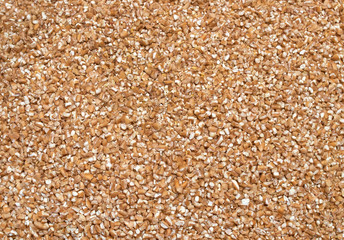 Background texture of crushed seed and grain mix for livestock and bird feed