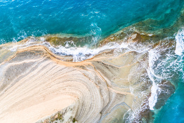 Blue sea texture with waves and foam