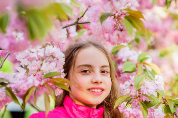 summer holiday. Childhood beauty. skincare spa. Natural cosmetics for skin. small girl in spring flower bloom. blossom smell, allergy. happy girl in cherry flower. Sakura tree blooming. Hello summer