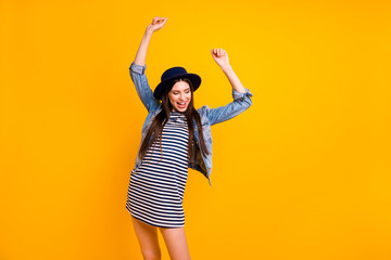 Portrait of her she nice-looking fascinating charming smart attractive lovely cheerful cheery straight-haired lady having fun disco isolated over bright vivid shine yellow background