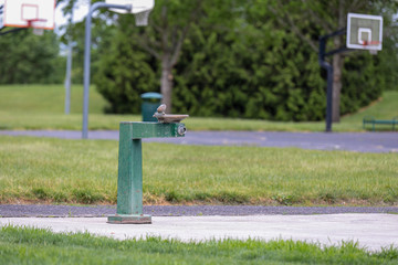 Green drinking water fountain in a park of Hillsboro, Oregon