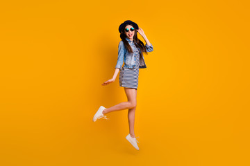 Full length body size view photo of cute carefree foolish teen teenager summer vacation laugh laughter touch hand wear specs fashionable youth denim skirt clothing isolated vibrant background