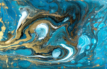 Blue and gold marbling pattern. Golden powder marble liquid texture.