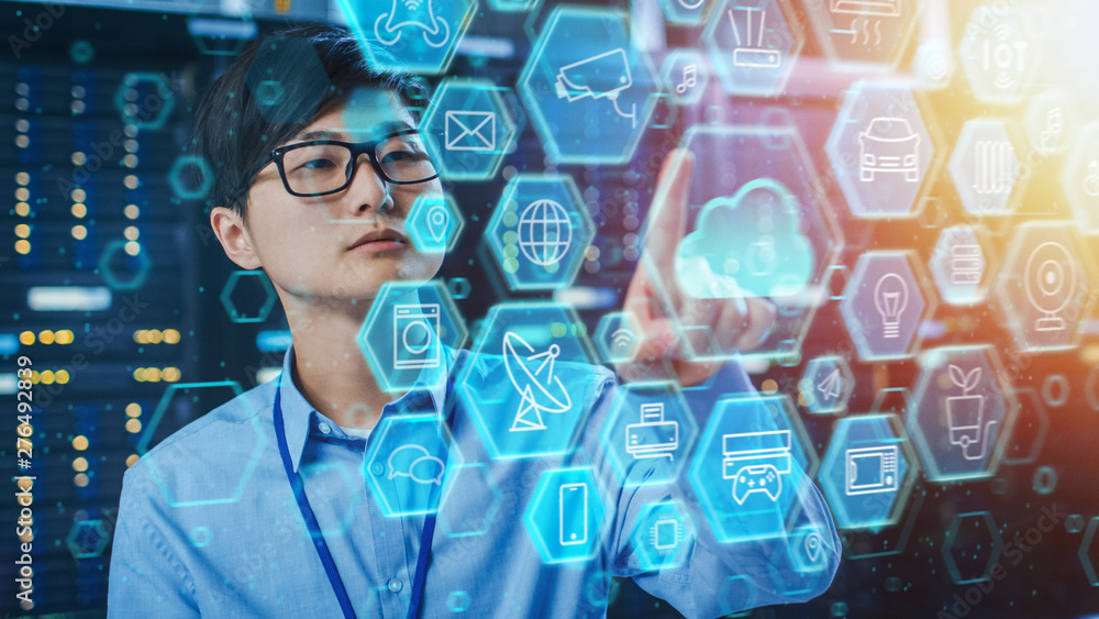 Aufkleber Shot of a Asian IT Engineer Working in a Data Center Server Room and Touching Cloud Icon. Cloud User Interface Concept with Different Computer Illustrative Icons and Symbols in the Foreground.