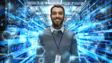 Shot of a Smiling IT Engineer Standing in the Middle of a Working Data Center Server Room. Visualizations of Data Transmission Through High Speed Internet. User Interface Icons in the Foreground.