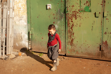 The baby is playing. Difficult and uncontrollable boy. Hyperactivity in children. Fidget child ran...