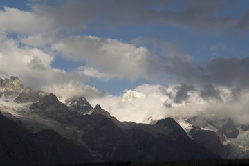 Fototapeta na wymiar High altittude mountains and clouds