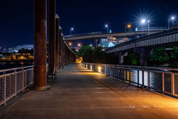 Fototapeta na wymiar Portland, Oregon \ USA - 09 June 2019: View at East bank Esplanade at night, long exposure photo.