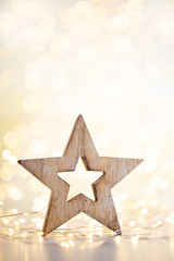 Fototapeta na wymiar Christmas bokeh background with decorative star.