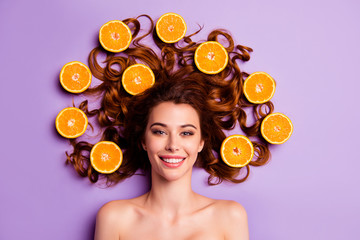 Fototapeta na wymiar Close-up portrait of her she nice-looking sweet winsome charming cute attractive lovely fascinating cheerful wavy-haired lady orange pieces hairdo in hairdress isolated over violet purple background