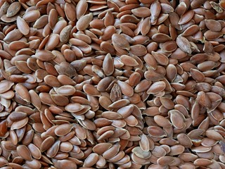 Close-up of Brown Flaxseeds, Food Background