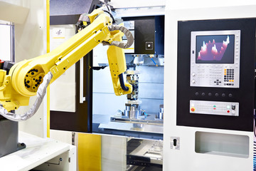 Vertical milling center and robotic arm © Sergey Ryzhov