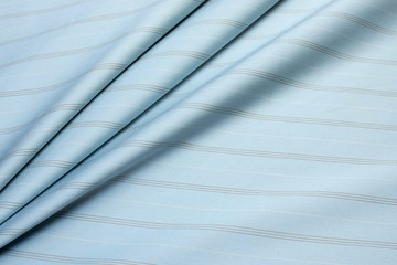 Cotton fabric. Strip. Blue color. Texture, background, pattern.