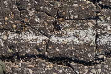 Macro texture of old cracked asphalt