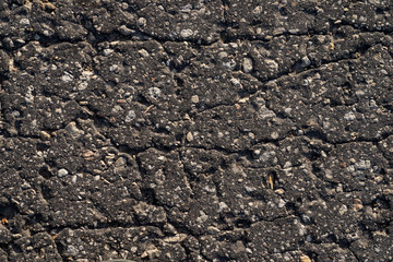 Macro texture of old cracked asphalt